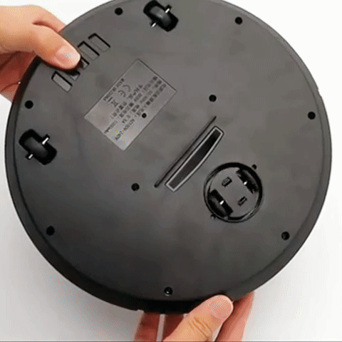Cordless robotic vacuum cleaner with smart navigation on wooden floor, showcasing three-in-one sweeping, vacuuming, mopping.