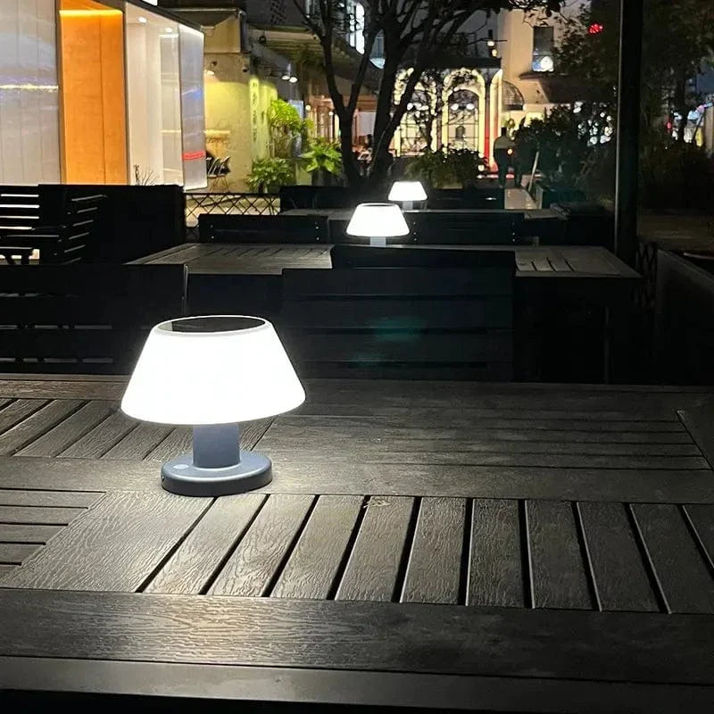 Cordless solar table lamp with LED, rechargeable via USB Type-C, features a sleek, minimalist design, perfect for outdoor use