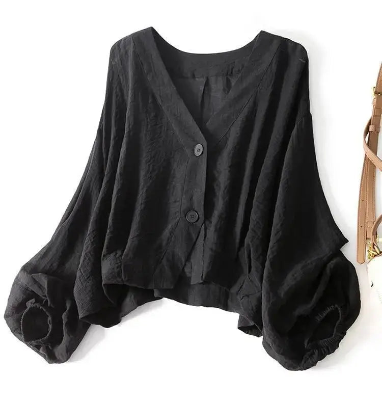 Stylish women's relaxed fit blouse in cotton linen, showcasing unique batwing sleeves and chic front button accents.