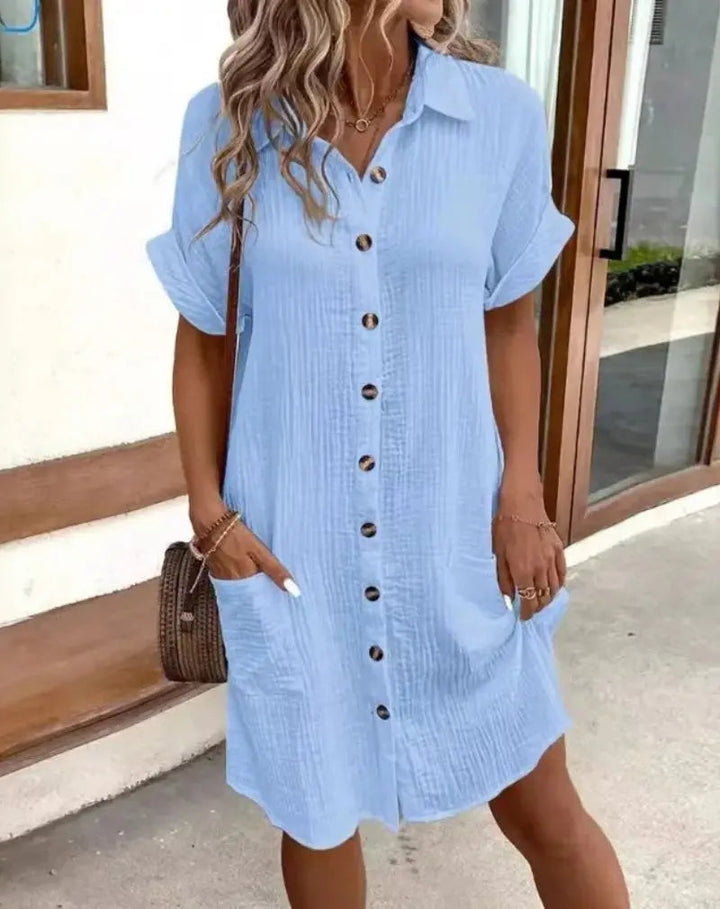 Casual women's short-sleeve shirtdress with patch pockets, perfect for summer everyday wear. Versatile button-down.