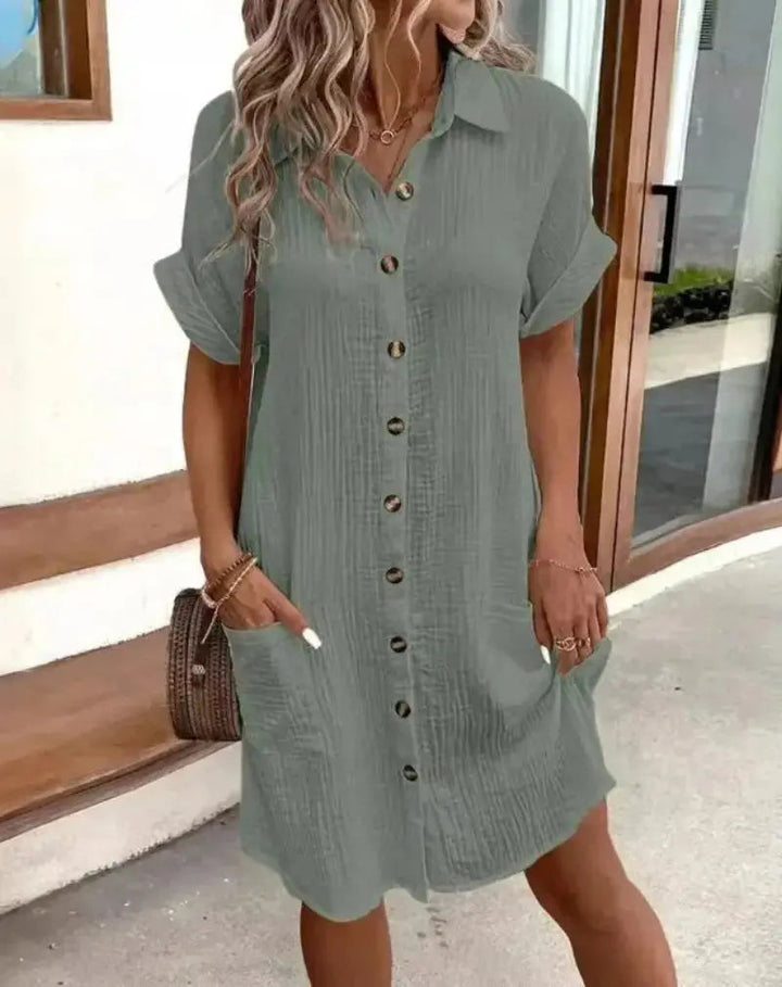 Versatile women's short-sleeve collared shirtdress. Relaxed fit, button-down, and patch pockets for effortless style.
