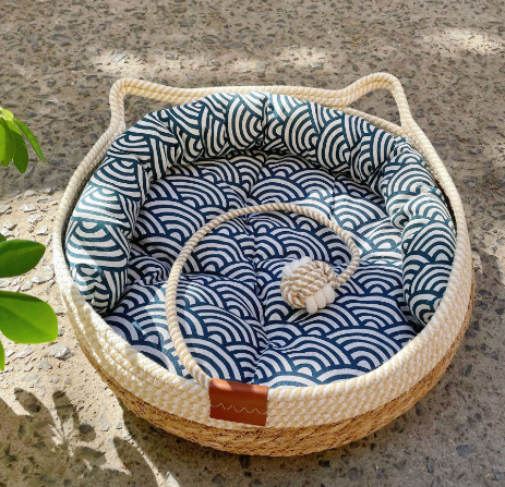 Cozy cat bed & scratcher combo with durable sisal play ball for ultimate pet comfort and play.