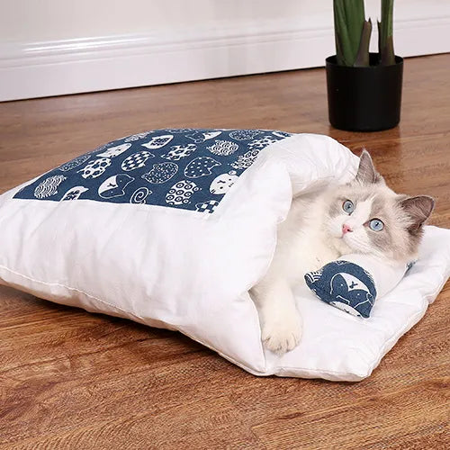 Cozy navy cat cave bed provides anxiety relief for pets. Soft, warm feline comfort for deep sleep.