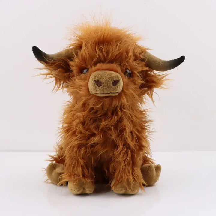 Cuddly Highland Cow plush toy, soft stuffed animal with shaggy fur, perfect for comfort & play.