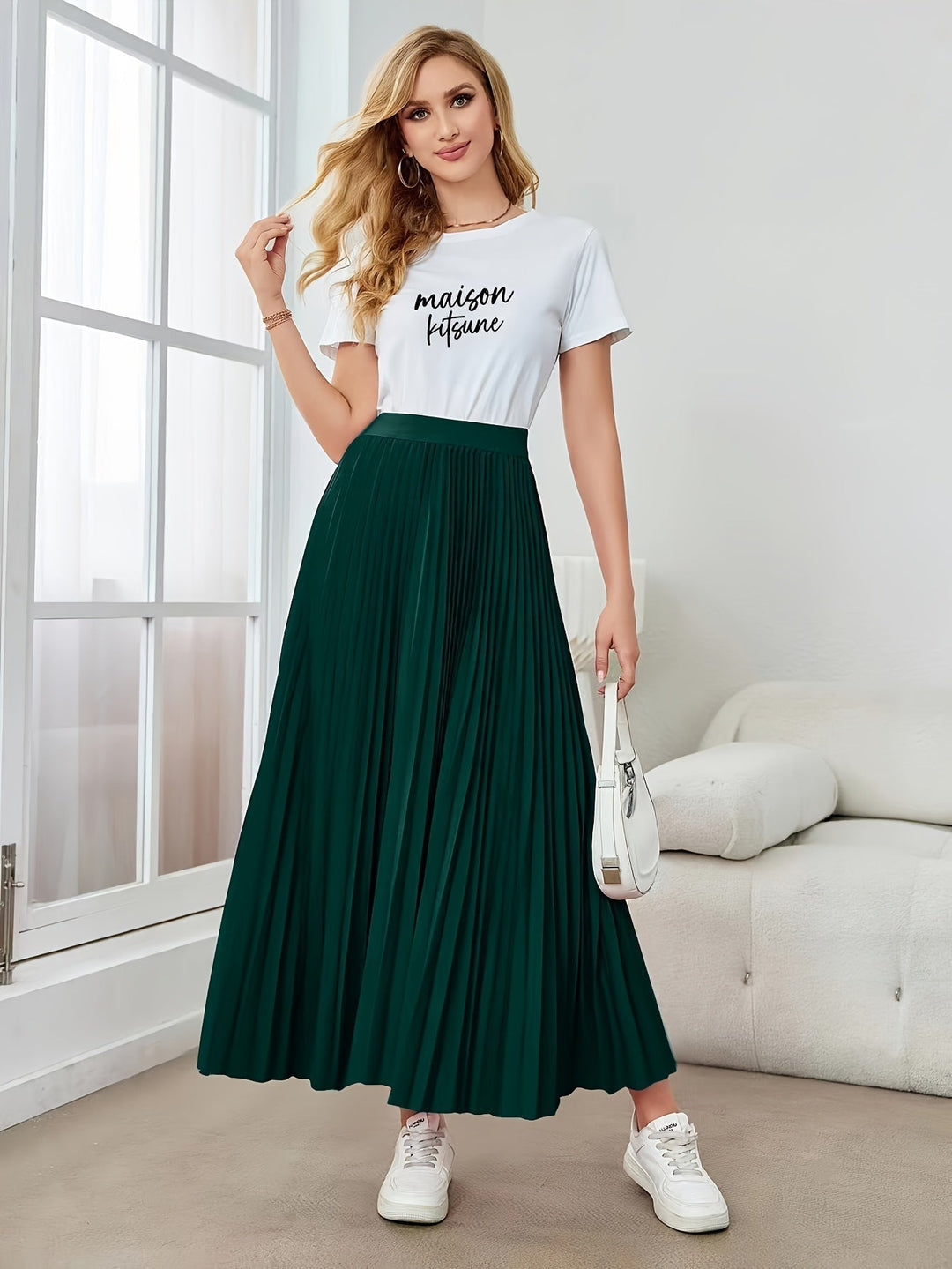 Chic women's midi skirt with delicate pleats and a versatile elastic waistband, perfect for office wear.