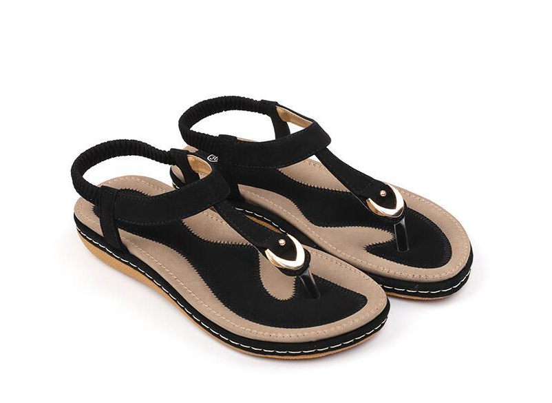 Comfortable women's T-strap sandals with elastic back for a secure, cushioned summer fit.