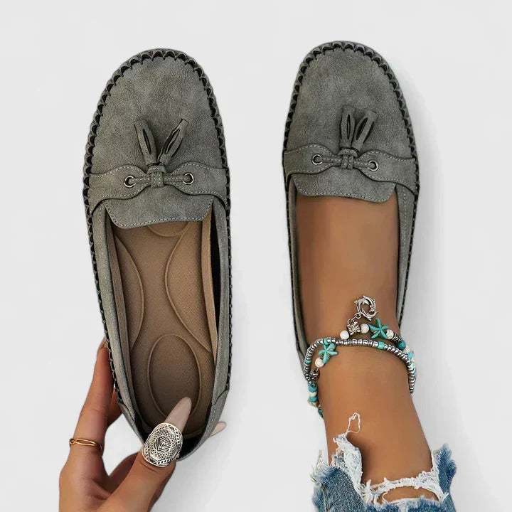 Fashionable women's loafers with elegant tassel, providing orthopaedic support & comfortable slip-on style.