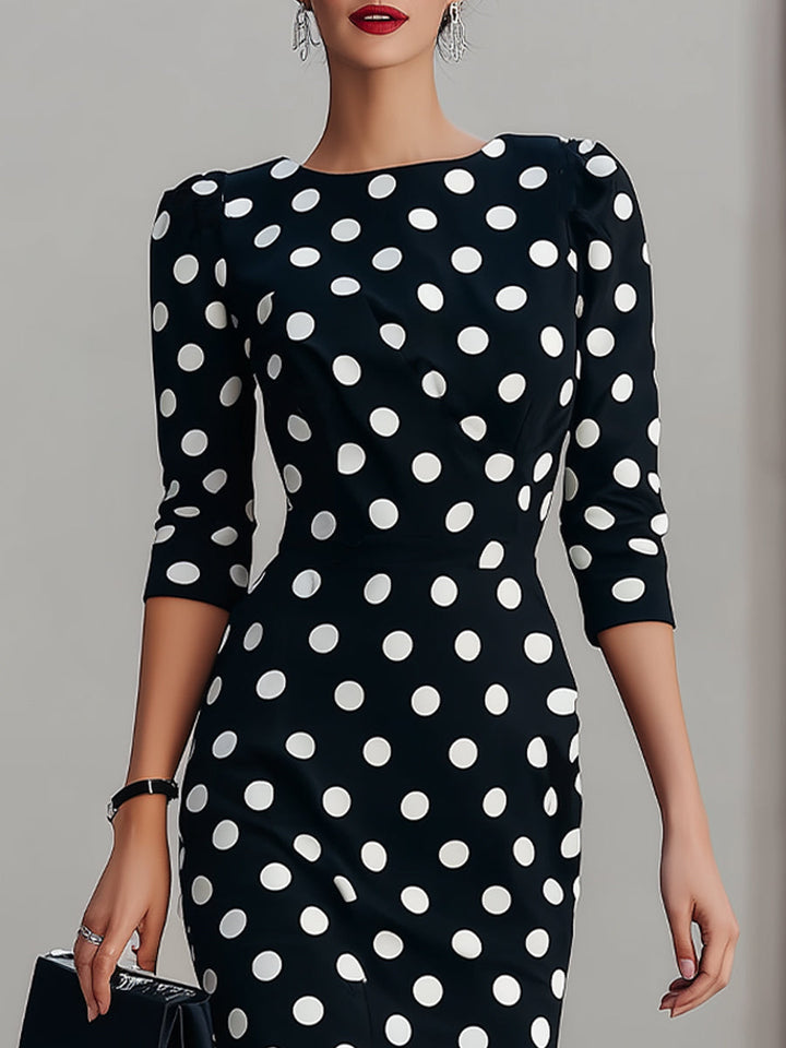 Women's black halter neck bodycon midi dress with dot print, a stylish choice for cocktail or evening wear.