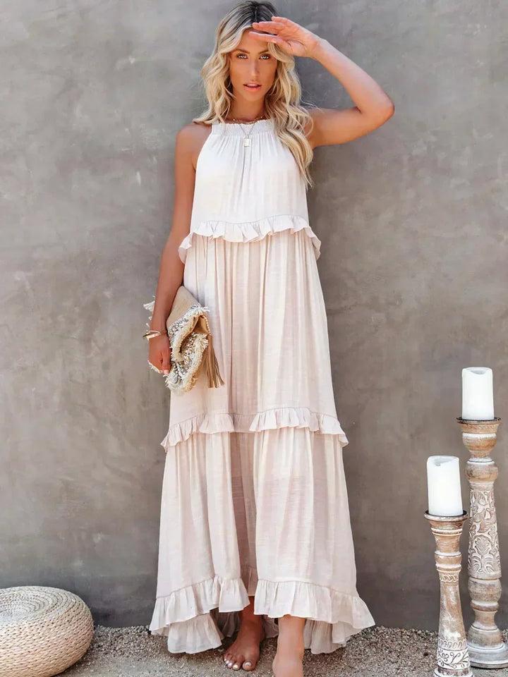 Casual women's halterneck maxi dress, with ruffles & pockets, perfect for beach holidays.