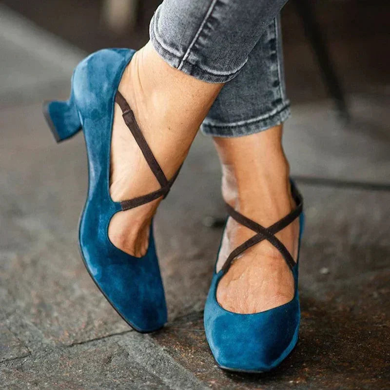 Elegant women's blue strappy mid-heel block sandals. Perfect for parties, formal events, and comfortable all-day wear.