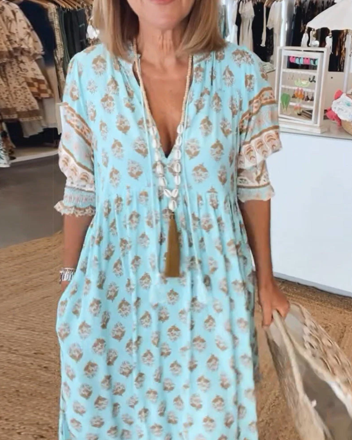 Flowy light blue versatile women's summer dress. Comfortable & elegant for warm weather everyday wear.