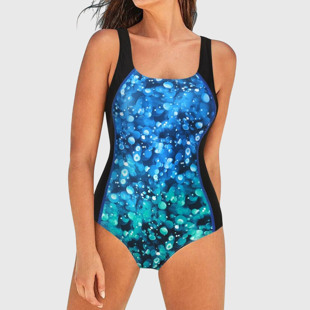 Fashionable women's shaping printed one-piece swimsuit, essential summer beachwear for vacations & pools.