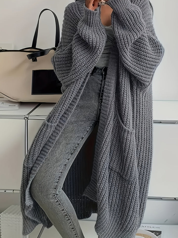 Women's chic V-neck button-front cardigan sweater, soft knit for cosy autumn fashion.