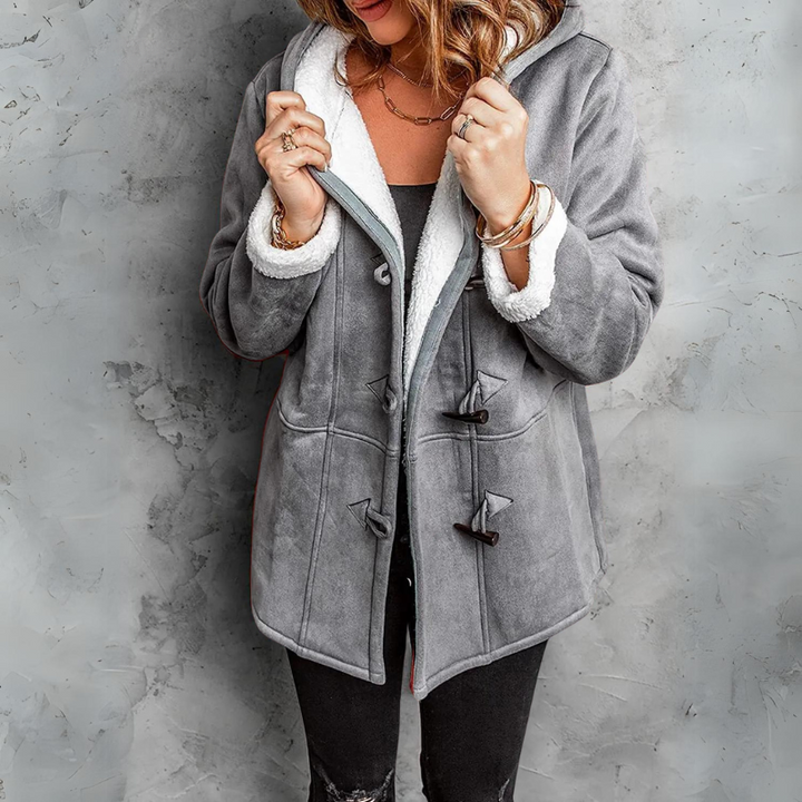 Warm women's winter toggle coat in soft Aspen fleece. Ideal for cozy outdoor fashion & chilly weather.