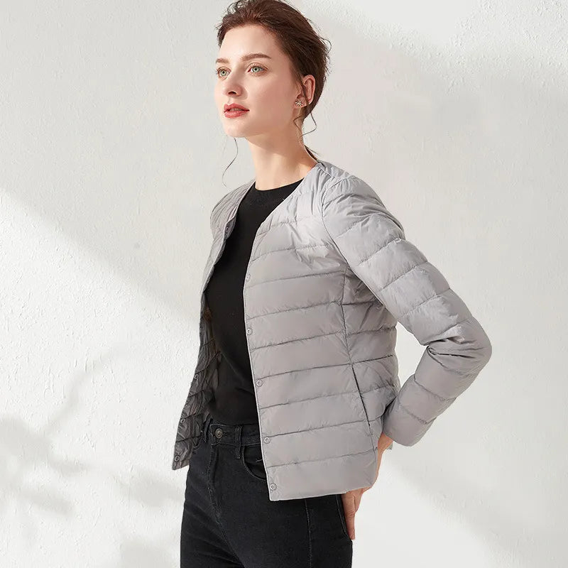 Versatile women's lightweight puffer jacket with a flattering slimming fit. Perfect for spring and fall.