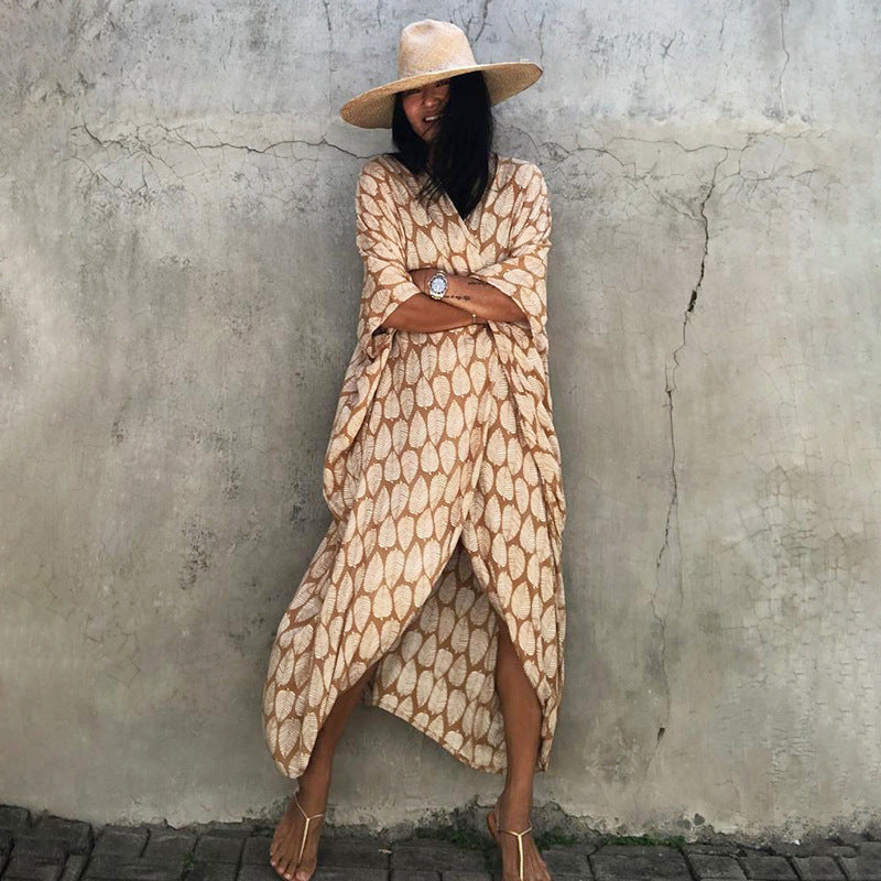 Flowy women's resort wear cover up, glamorous sun protection for a stylish beach vacation.