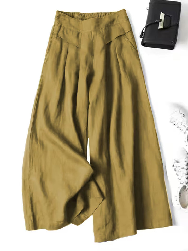 Effortless women's loose-fit wide-leg trousers, designed for ultimate comfort & breathable casual style.