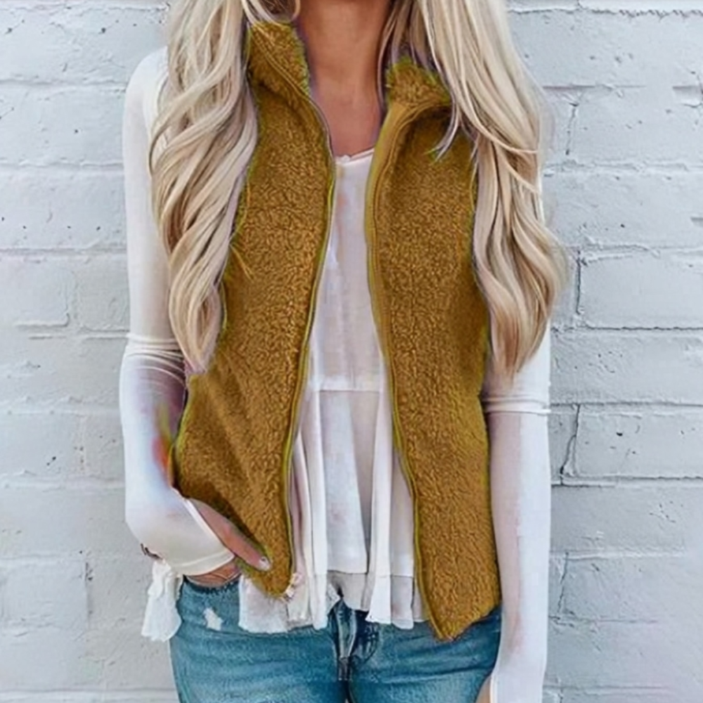 Versatile women's cozy fleece vest, ideal for layering in any casual autumn or winter ensemble.