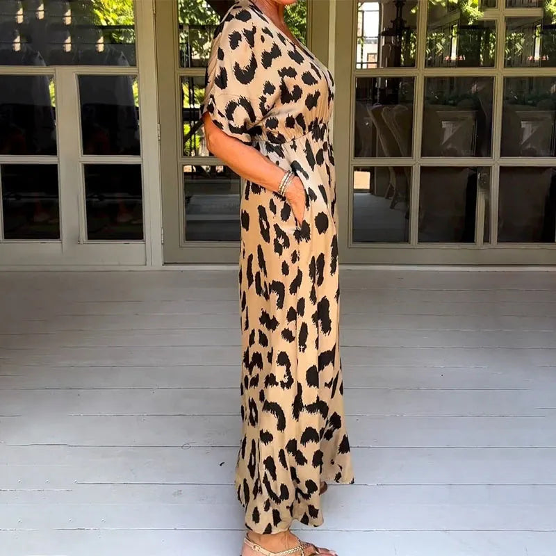 Flowing women's maxi dress with a stylish leopard print and v-neck. Comfortable long casual summer animal print dress.