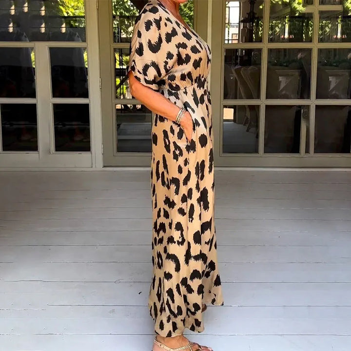 Flowing women's maxi dress with a stylish leopard print and v-neck. Comfortable long casual summer animal print dress.
