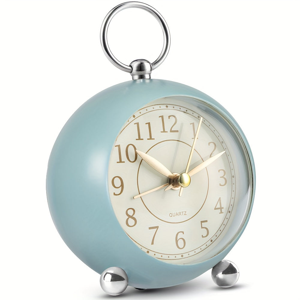 Pink vintage analogue clock, perfect for bedroom decor. Features quiet movement & helpful night light.
