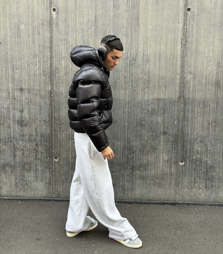 Durable men's black puffer jacket. Provides ultimate warmth and style for cold weather and winter activities.