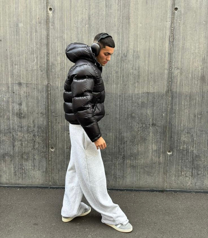 Durable men's black puffer jacket. Provides ultimate warmth and style for cold weather and winter activities.