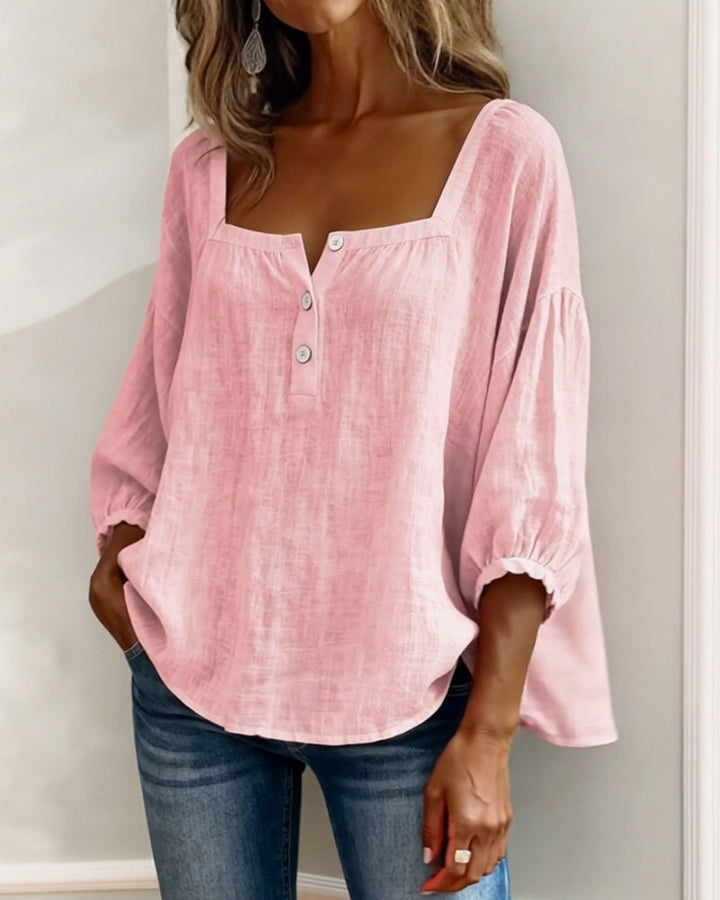 Versatile women's puff sleeve top, relaxed fit, ideal for casual chic looks.