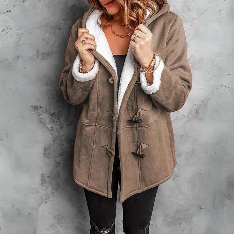 Cozy women's Aspen fleece toggle coat with a hood, offering ultimate winter warmth & stylish comfort.