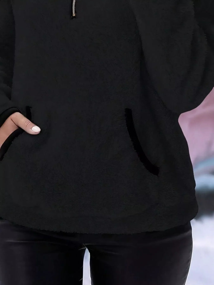 Stylish women's half-zip sweater, ideal for cozy autumn and winter outfits.