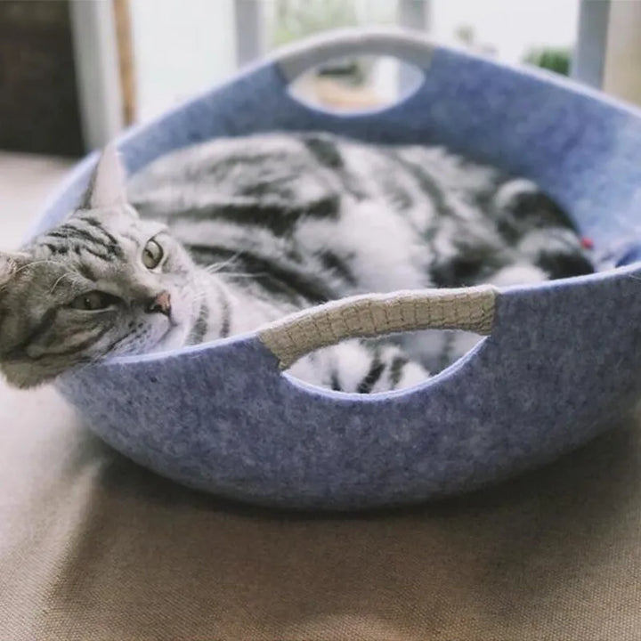 Felt cat bed with easy-carry handles, a super soft & cozy basket design for ultimate feline comfort.