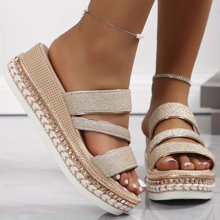 Fashionable women's rose gold multi-strap platform heels with an open-toe, offering elegance & support.