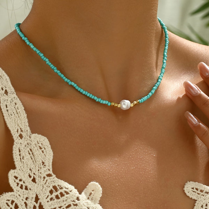 Elegant women's minimalist necklace featuring a genuine turquoise bead & a classic white pearl on a delicate chain.