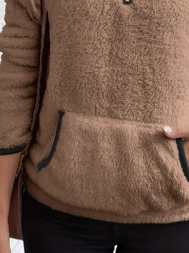 Soft women's long sleeve half-zip sweater, perfect for casual layering.