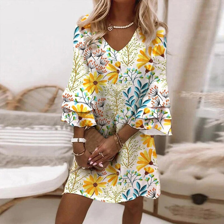 Chic spring/summer mini dress featuring a flattering V-neck and seductive bell sleeves, a must-have for parties.