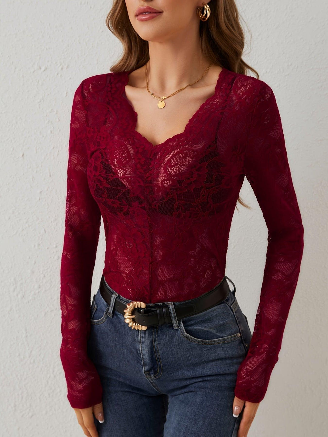 Fitted women's lace V-neck top, sheer long sleeves, elegant for evening wear & special occasions.