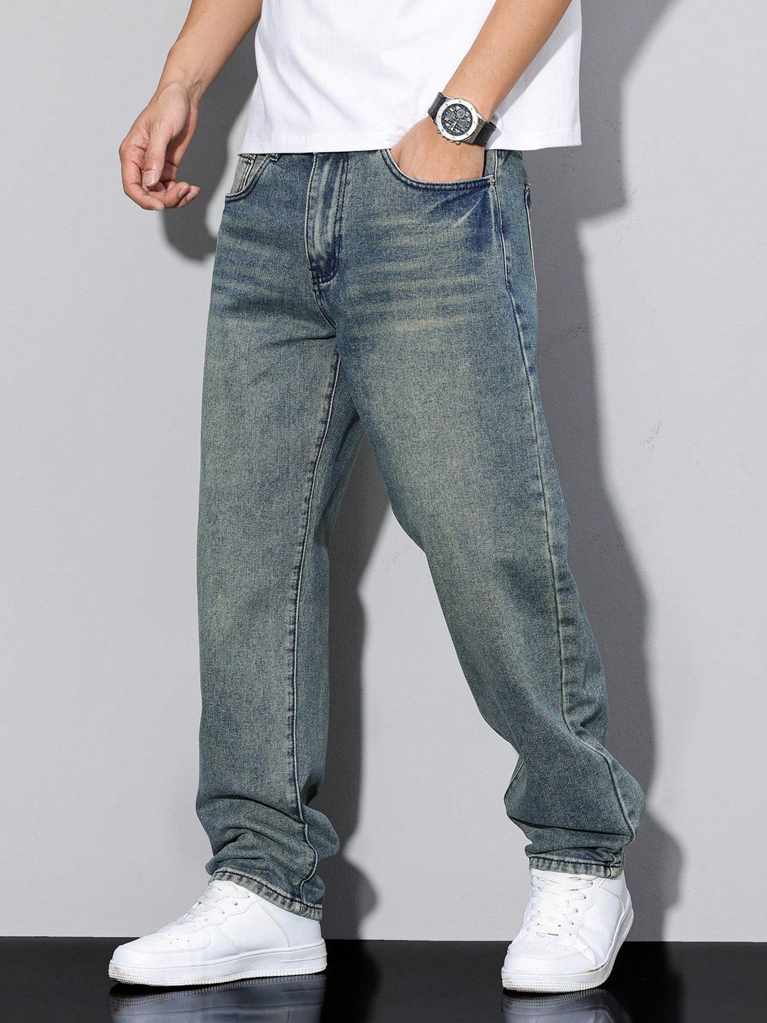 Modern men's straight leg jeans in a casual washed denim, perfect for a relaxed fit.