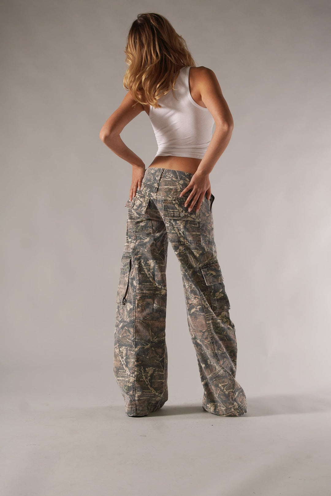 Relaxed fit women's camouflage cargo trousers with practical utility pockets for spring & autumn casual wear.