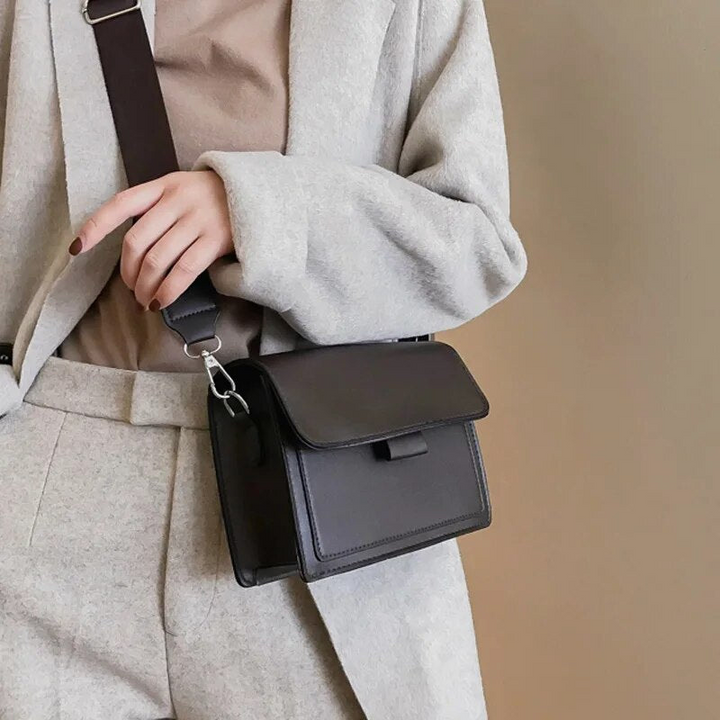 Modern women's small bag, functions as a practical crossbody or elegant shoulder bag, great for any outfit.