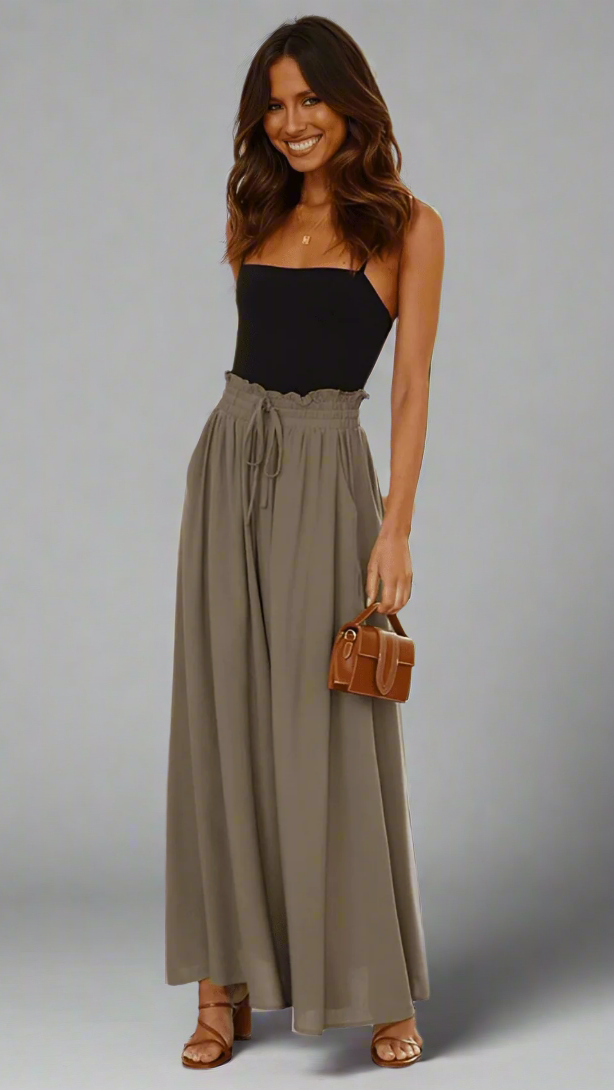 Front view: Women's Lily wide-leg trousers, showcasing relaxed fit & elastic waistband.