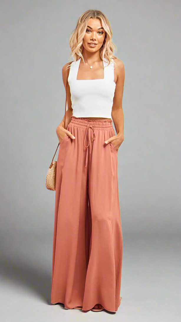 Brightly colored women's Lily wide-leg trousers, showcasing elastic waist & comfort.