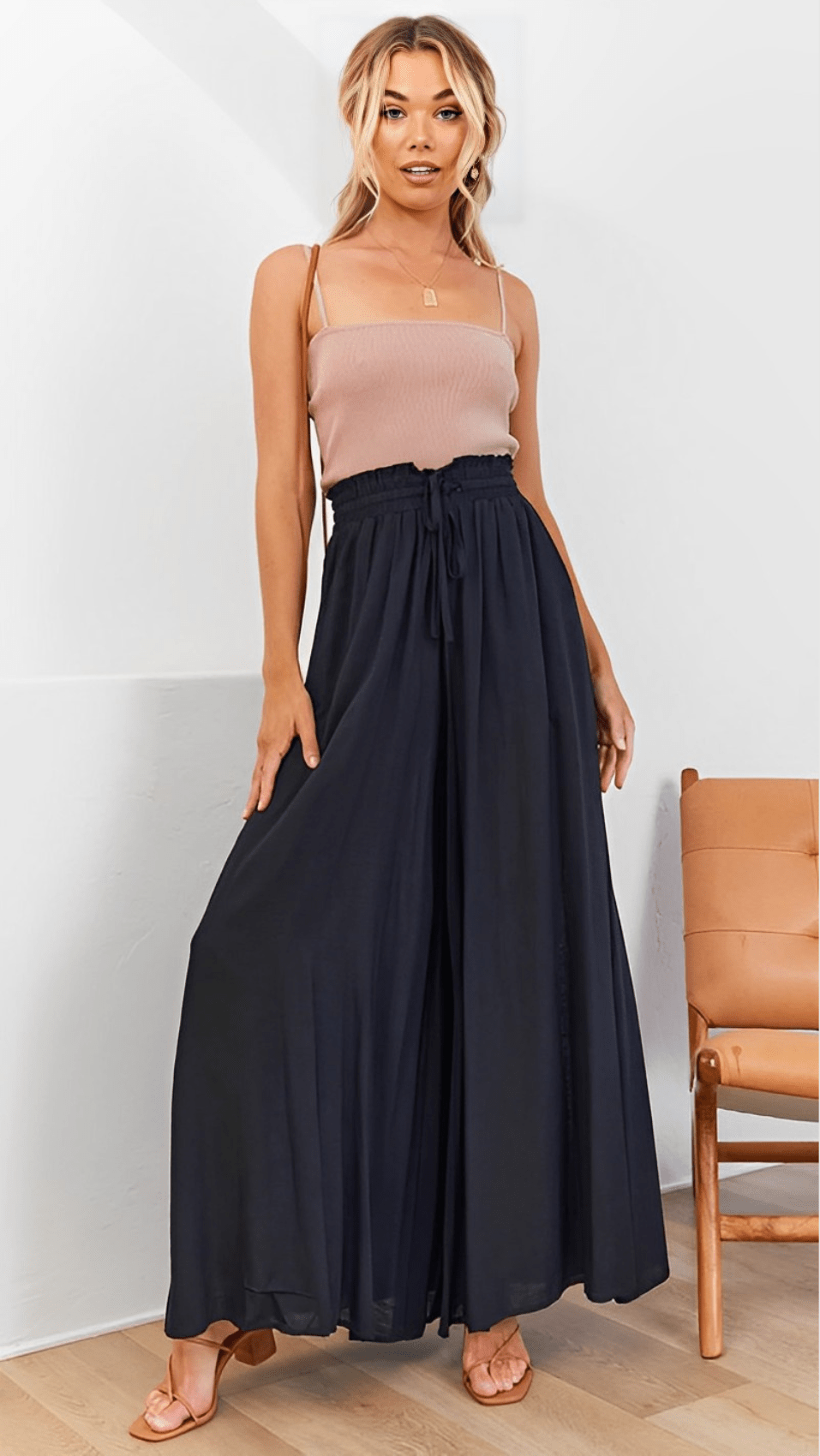 Mannequin wearing Lily wide-leg trousers, highlighting the comfortable, flowy silhouette.