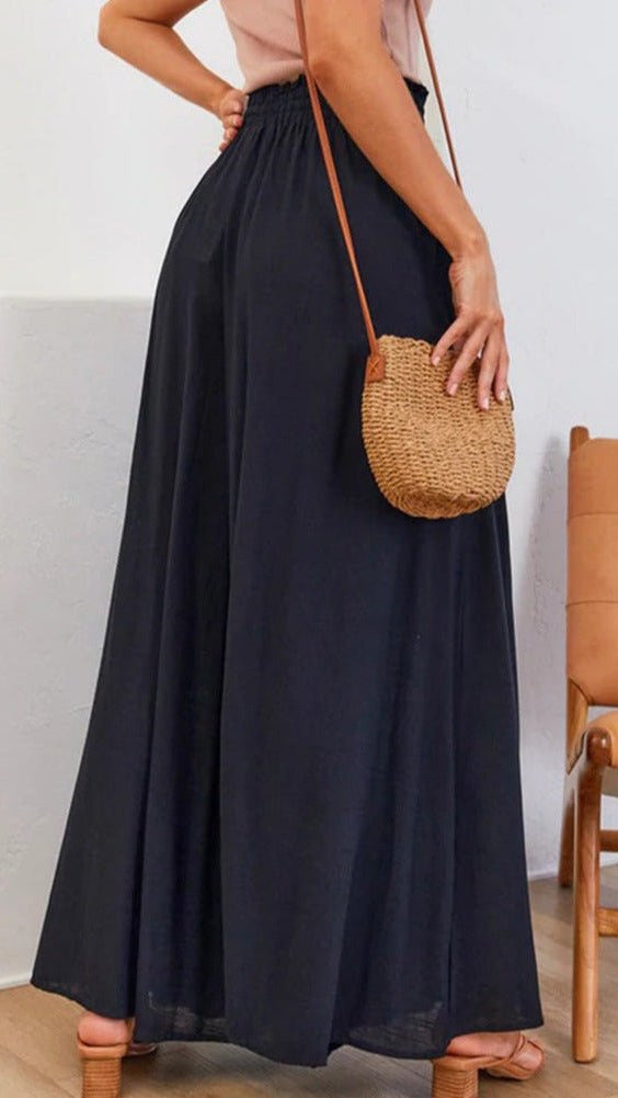 Back view: Women's comfortable wide-leg trousers, emphasizing the elastic waistband.