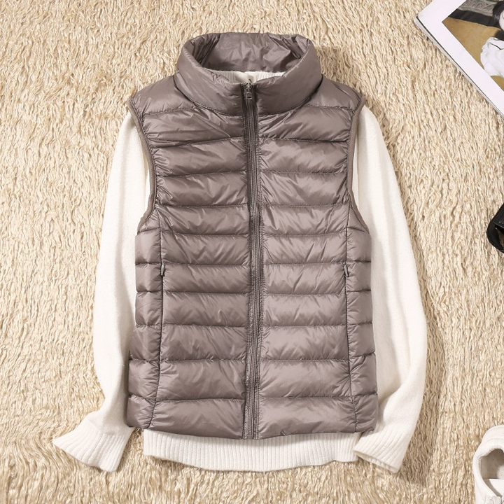 A versatile women's quilted sleeveless vest, great for casual or chic layering outfits.