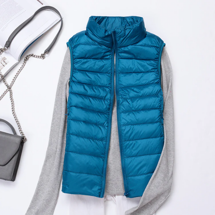 This chic women's quilted vest offers stylish sleeveless layering and warmth.