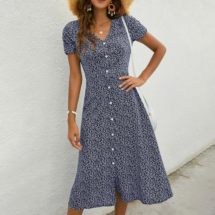 Effortless navy blue flowy midi summer dress for women. Relaxed fit, perfect for casual or vacation style.
