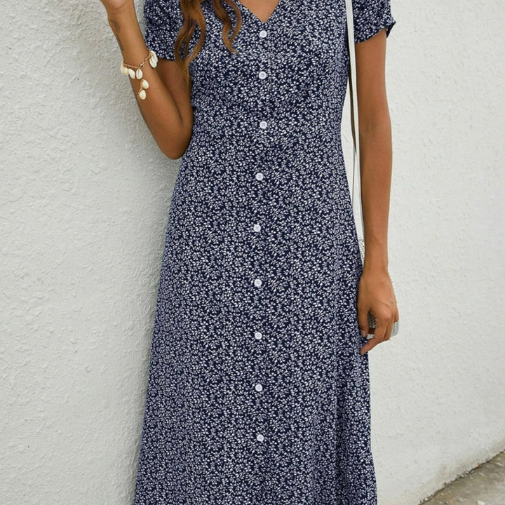 Comfortable navy blue midi dress for women. Versatile, airy flowy design perfect for summer casual wear.