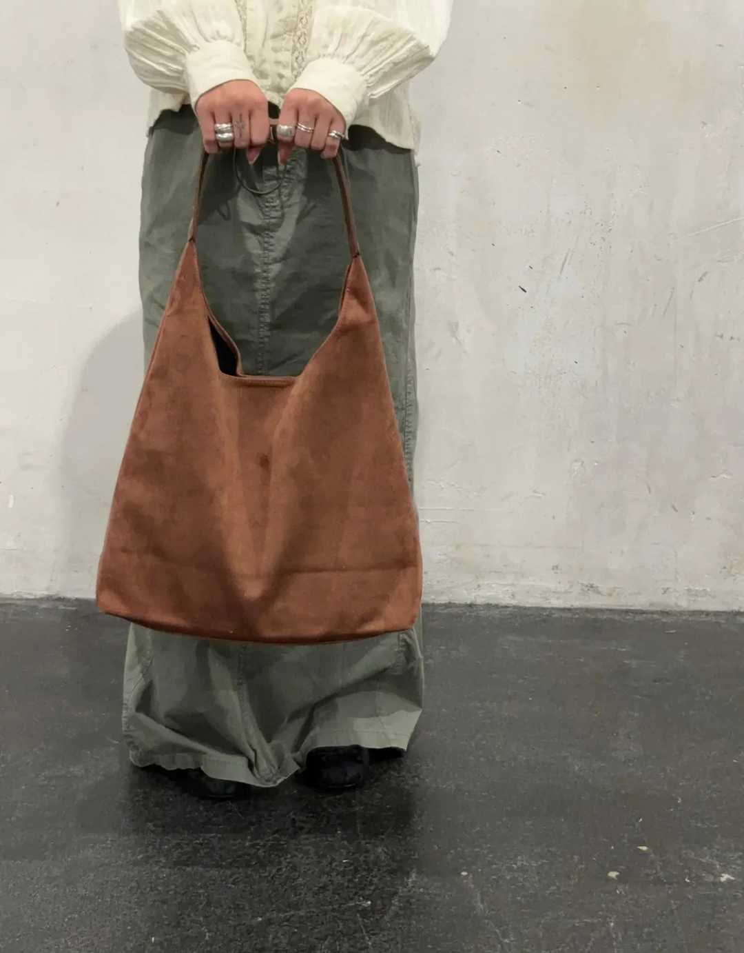 Stylish women's shoulder bag on model, showcasing its elegant design and versatile appeal.