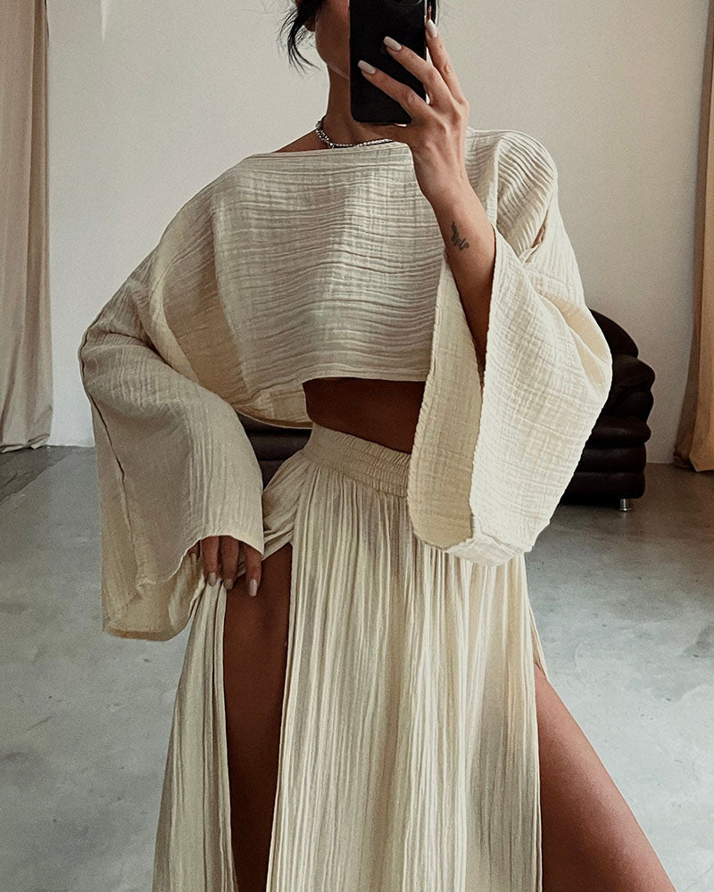 Chic women's crop top & side split maxi skirt set. Elegant two-piece co-ord, perfect for stylish spring/summer wear.