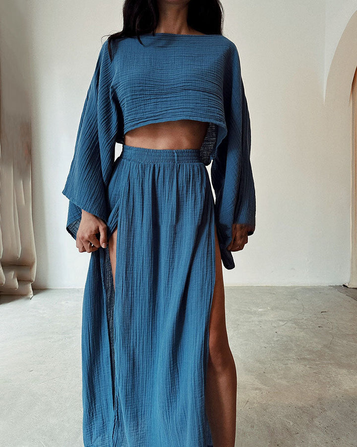 Coordinated women's long sleeve crop top & side split maxi skirt ensemble. Stylish two-piece for versatile fashion.